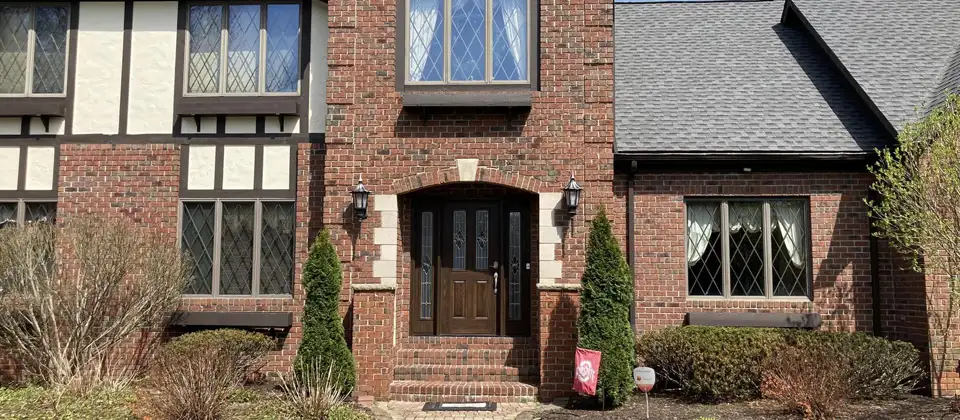 front of house showing updated windows and doors installed by Medina Patio Doors